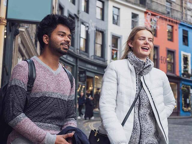 Global College students share a laugh on Victoria Street, Edinburgh