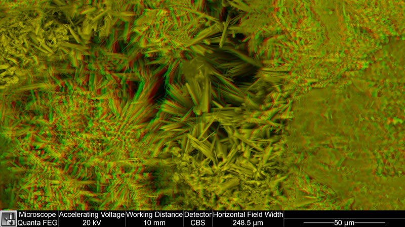 Radiating aragonite crystals in a sandstone pore