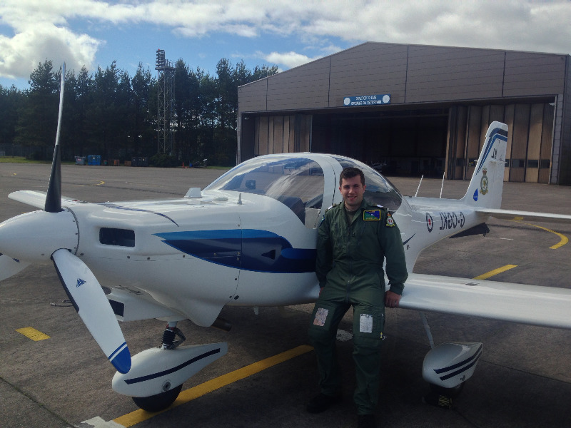 Neil herron beside small aeroplane