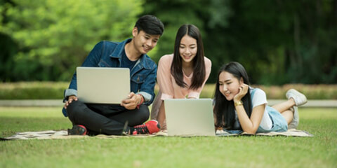 Students sitting on grass
