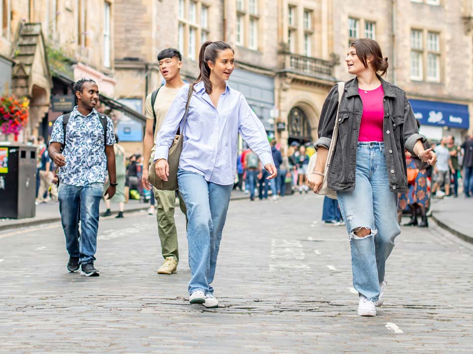 Students walking down Cockburn Street in Edinburgh
